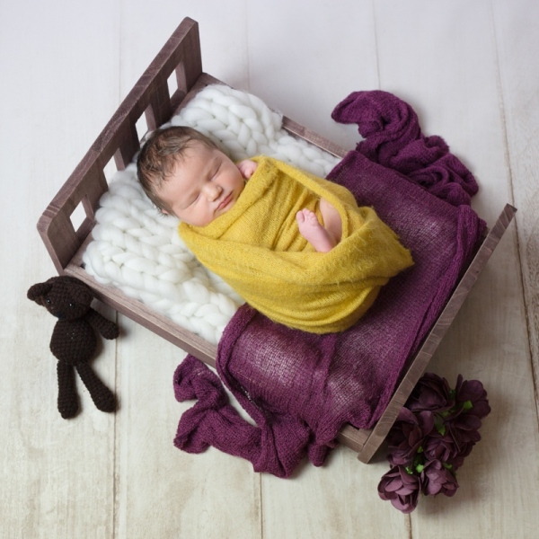Portraits naissance Ardennes photo bébé petit lit